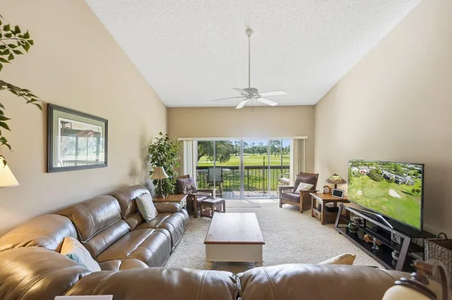 a bedroom with a bed and large window