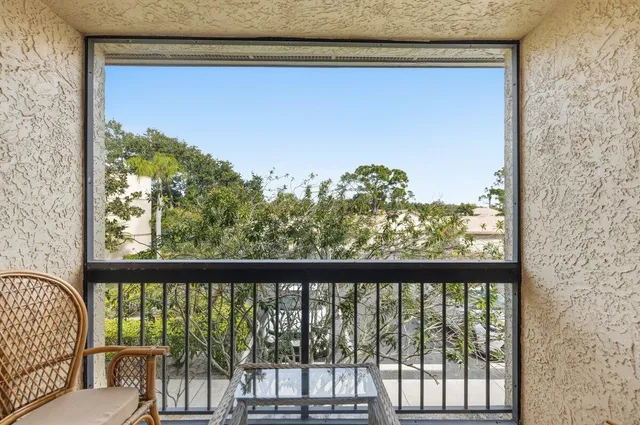a view of a street with a cars parked in front of it