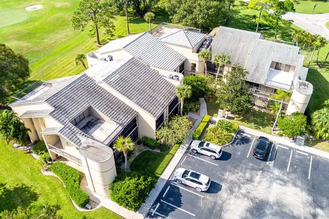 an aerial view of a house with a garden and plants