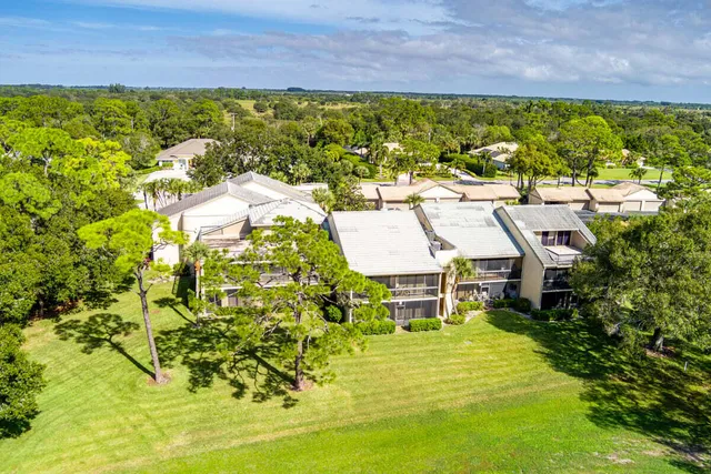 an aerial view of residential house with outdoor space and swimming pool