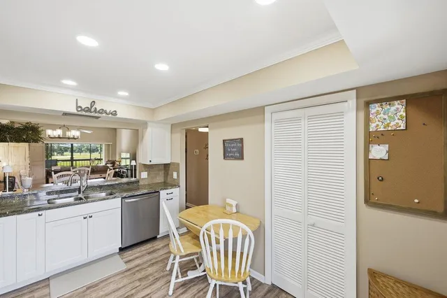 a large kitchen with a table and chairs