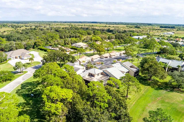 a view of a swimming pool with an outdoor seating and a garden