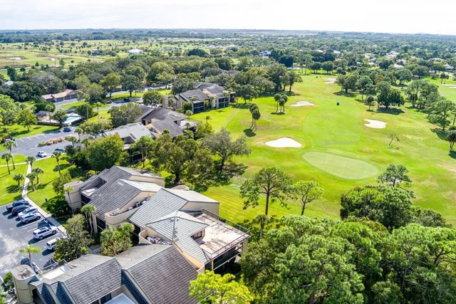 a view of a swimming pool with a yard