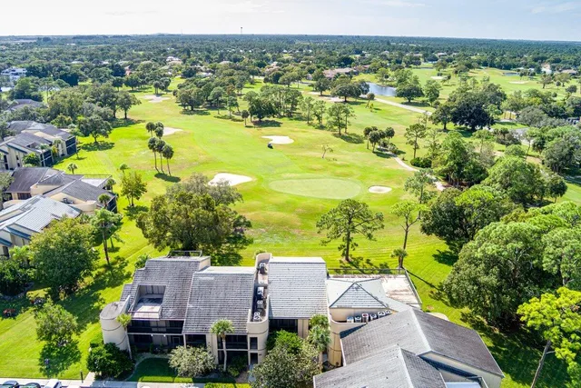 a view of a swimming pool with sitting area