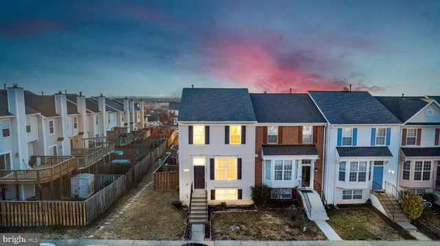 a front view of a house with large windows