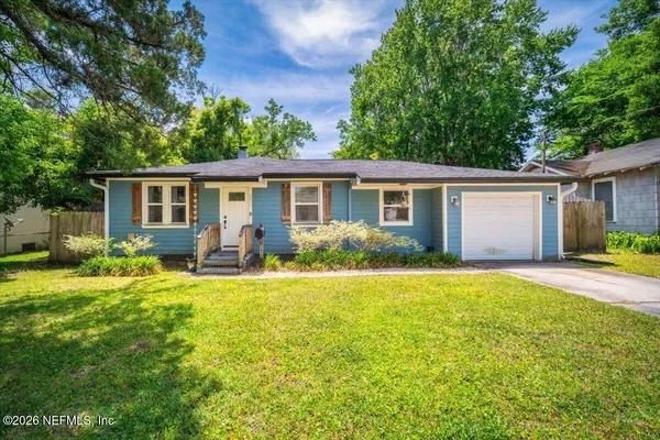 front view of a house with a yard