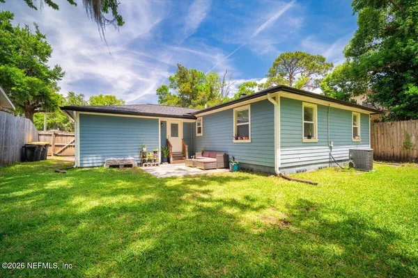 a front view of house with yard and seating area