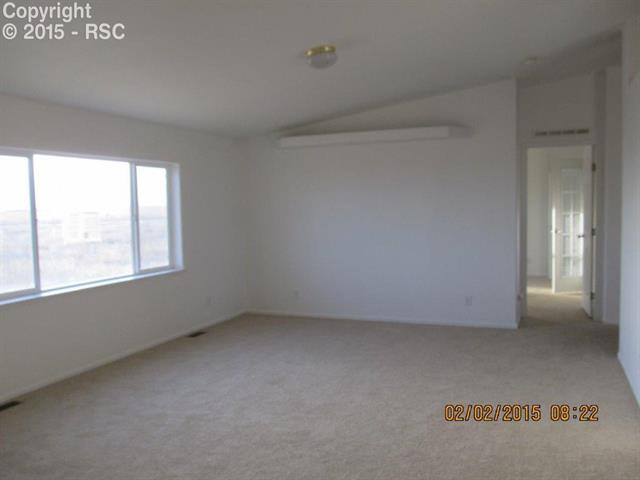 21376 County Road South, Unit 2 Rush, CO 80833 - Photo 13 of 17 Lots of light in the living room for your plants on the shelf above.
