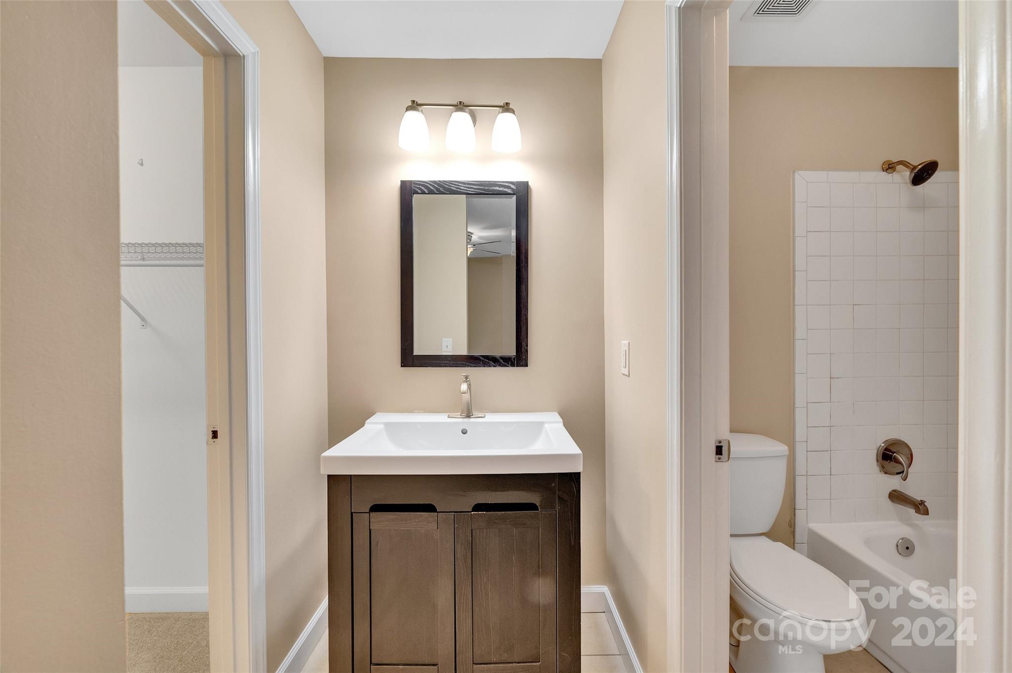 3076 Point Clear Drive Tega Cay, SC 29708 - Photo 11 of 28 a bathroom with a sink a toilet and shower