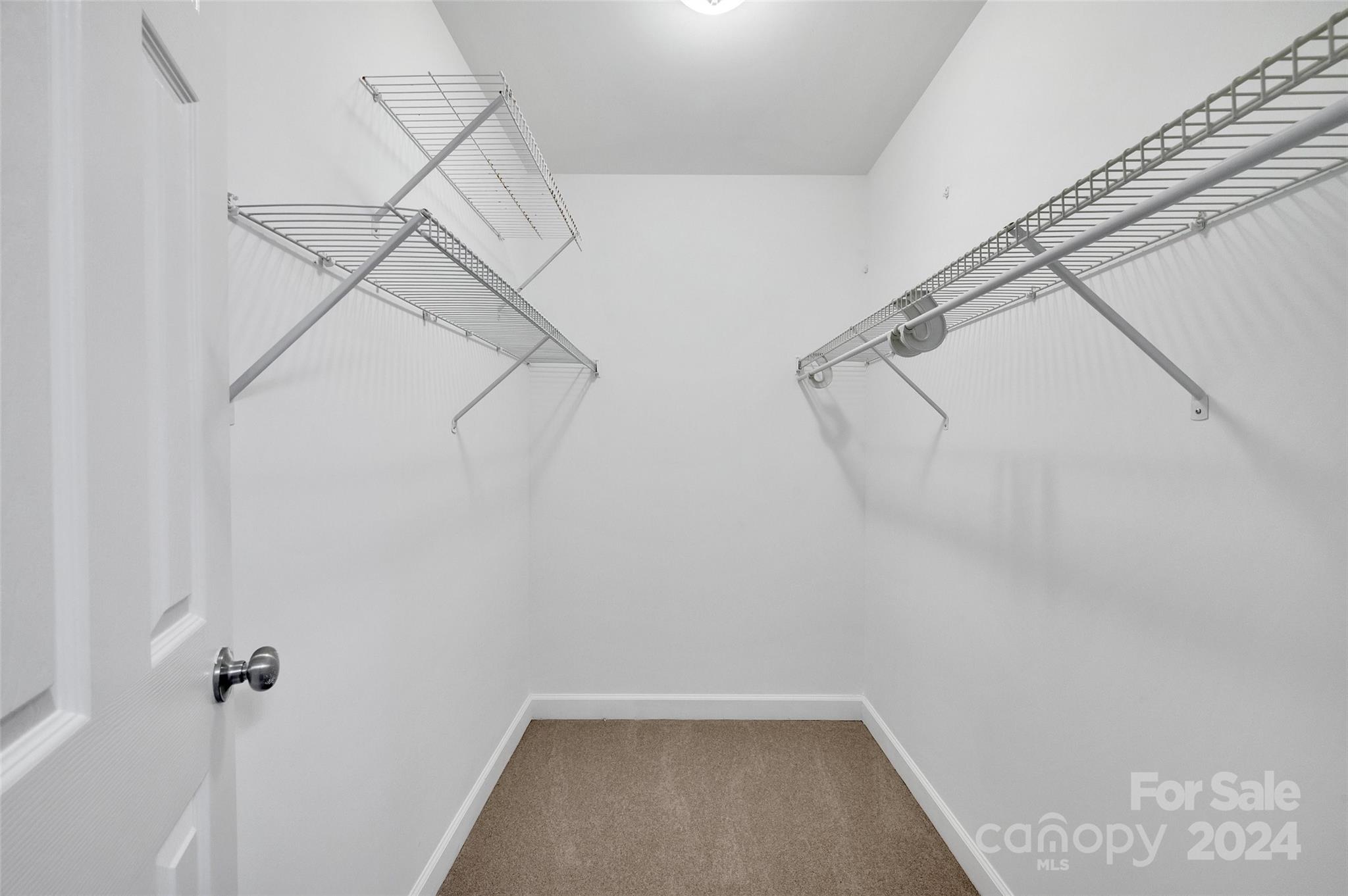 3076 Point Clear Drive Tega Cay, SC 29708 - Photo 12 of 28 a view of a room with racks on the wall