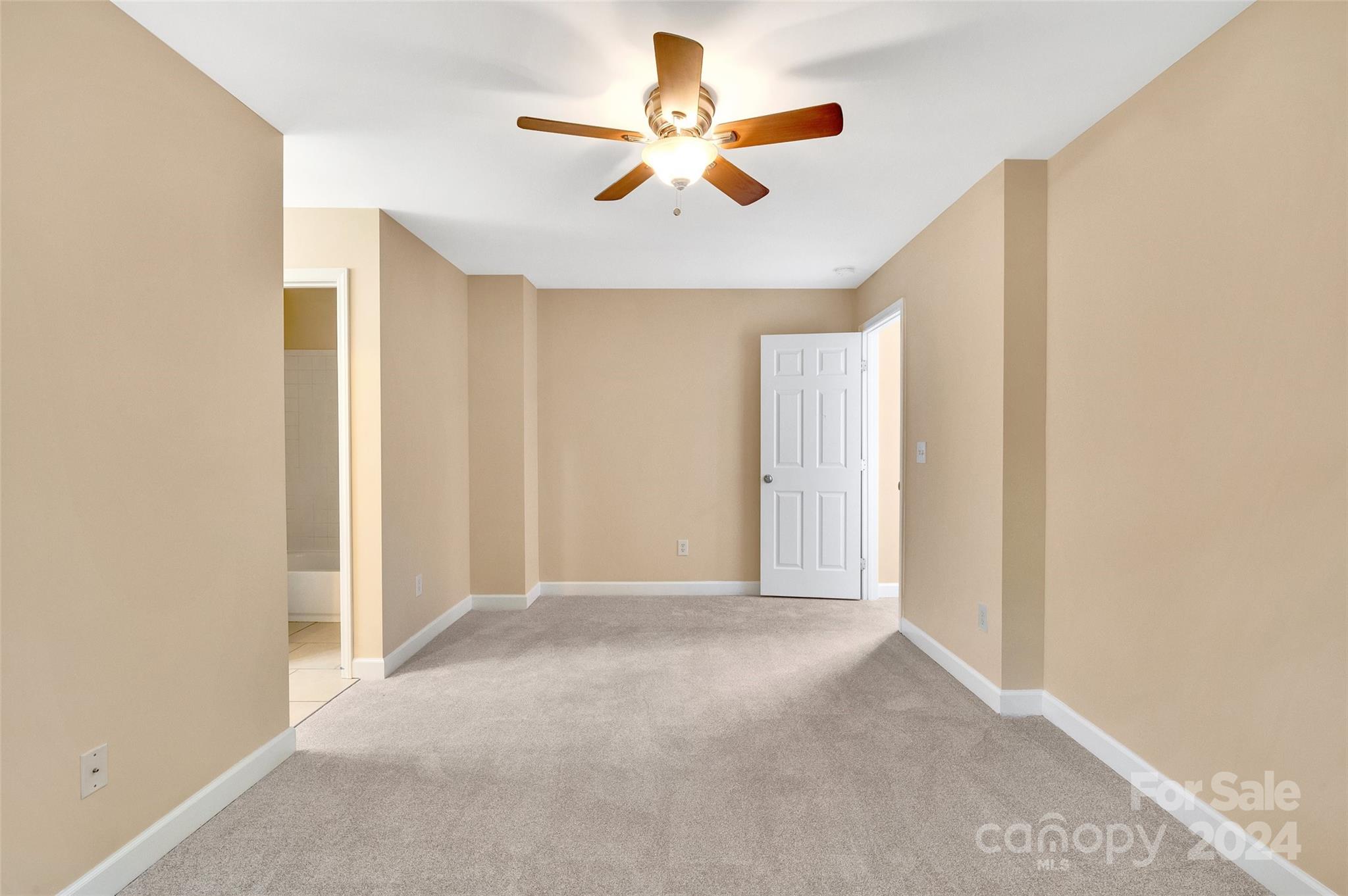 3076 Point Clear Drive Tega Cay, SC 29708 - Photo 13 of 28 a view of an empty room with a ceiling fan