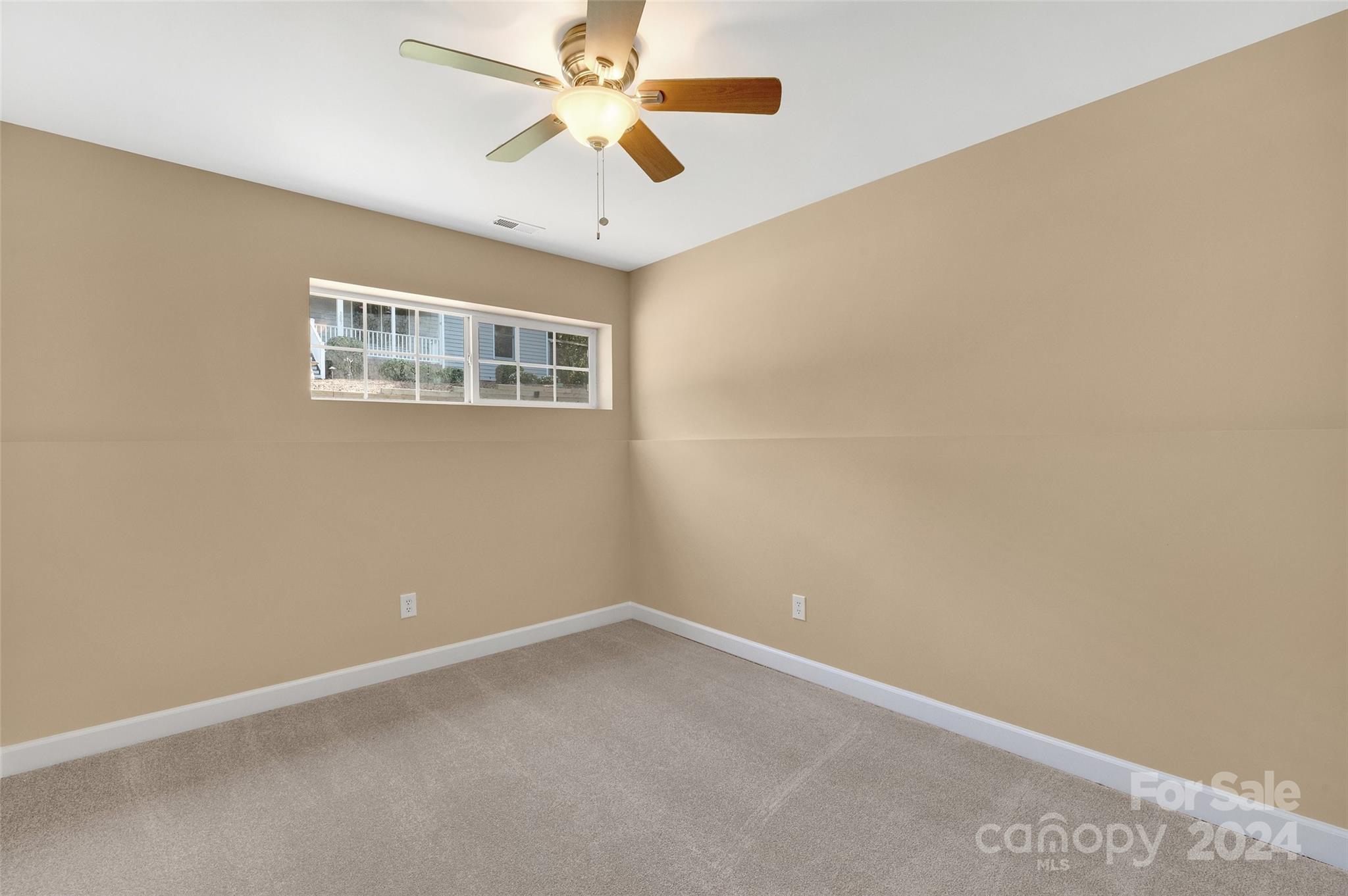3076 Point Clear Drive Tega Cay, SC 29708 - Photo 16 of 28 an empty room with a window and a fan