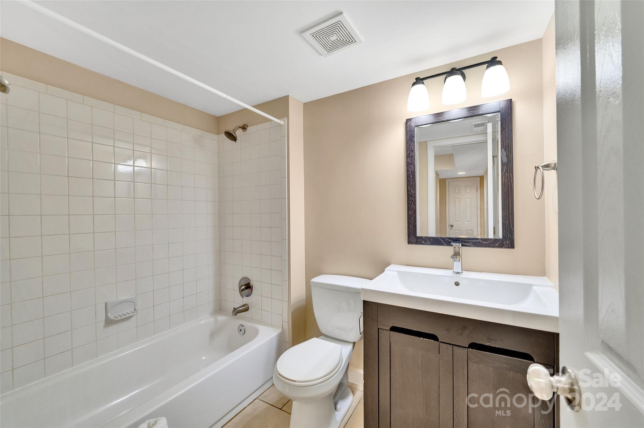 3076 Point Clear Drive Tega Cay, SC 29708 - Photo 17 of 28 a bathroom with a sink a toilet and shower