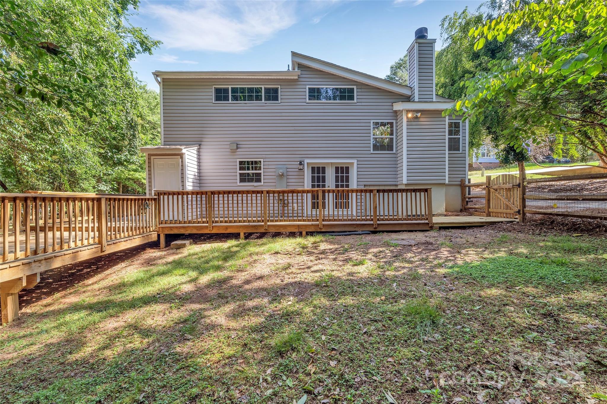 3076 Point Clear Drive Tega Cay, SC 29708 - Photo 19 of 28 a view of a house with backyard and trees