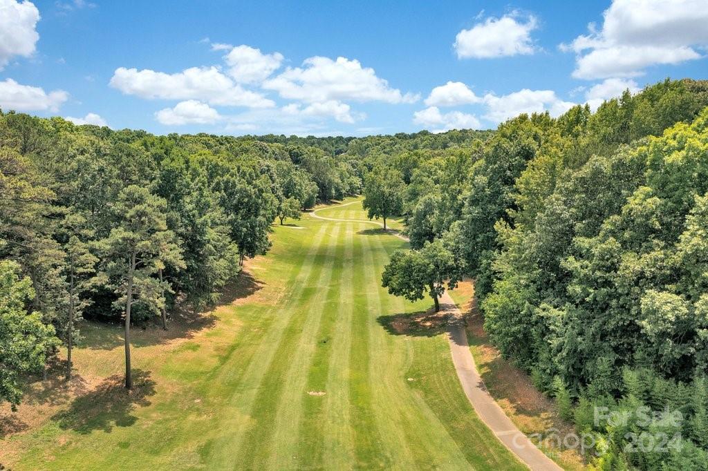 3076 Point Clear Drive Tega Cay, SC 29708 - Photo 24 of 28 a view of a swimming pool with a yard