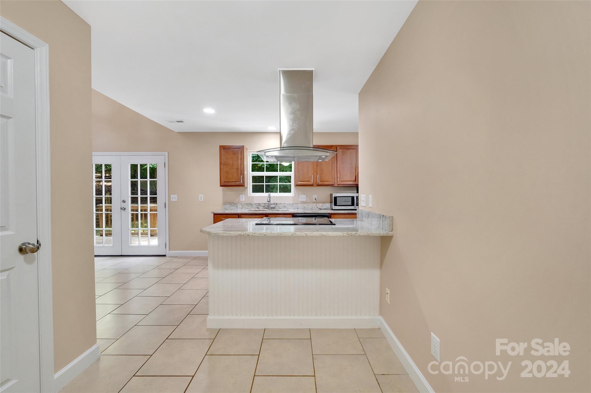 3076 Point Clear Drive Tega Cay, SC 29708 - Photo 9 of 28 a large white kitchen with a sink and a refrigerator