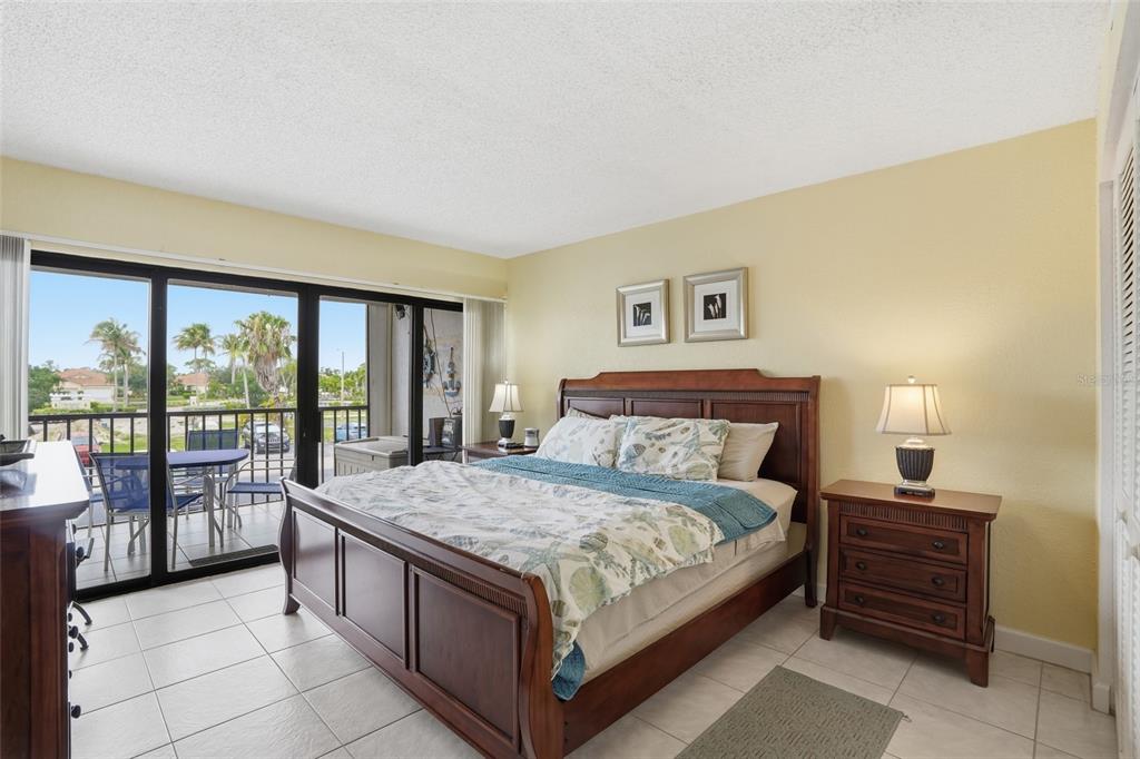 3170 Matecumbe Key Road, Unit 127 Punta Gorda, FL 33955 - Photo 10 of 22 a bedroom with a large bed and a large window