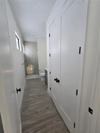 a view of a room with wooden floor and staircase
