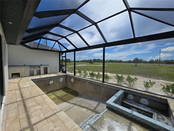 a view of a swimming pool with a lounge chair