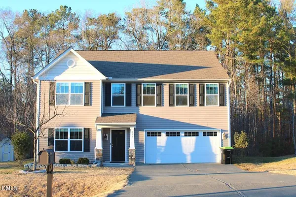 a house view with a garden space