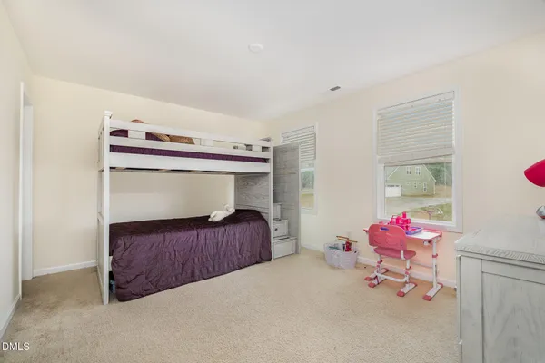 a view of an empty room and a window