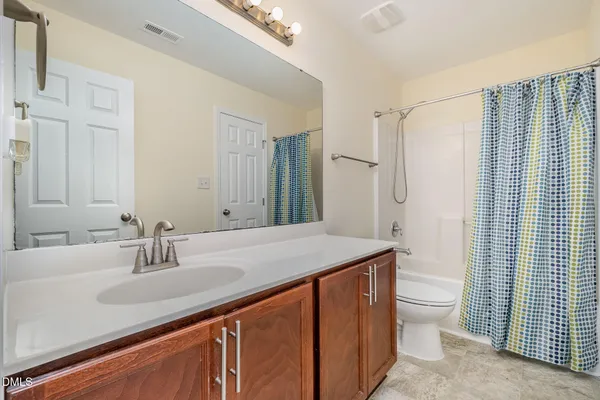 a store room with lots of furniture and clutter