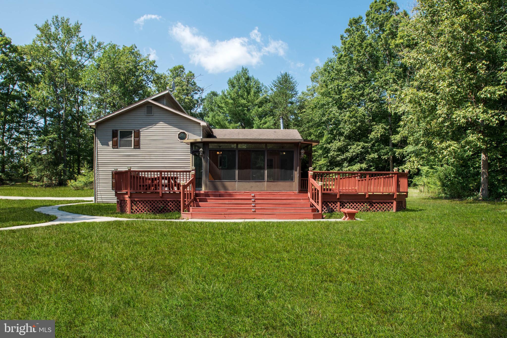 105 Eley Road Fredericksburg, VA 22406 - Photo 28 of 38 Back view shows the deck with the lovely yard