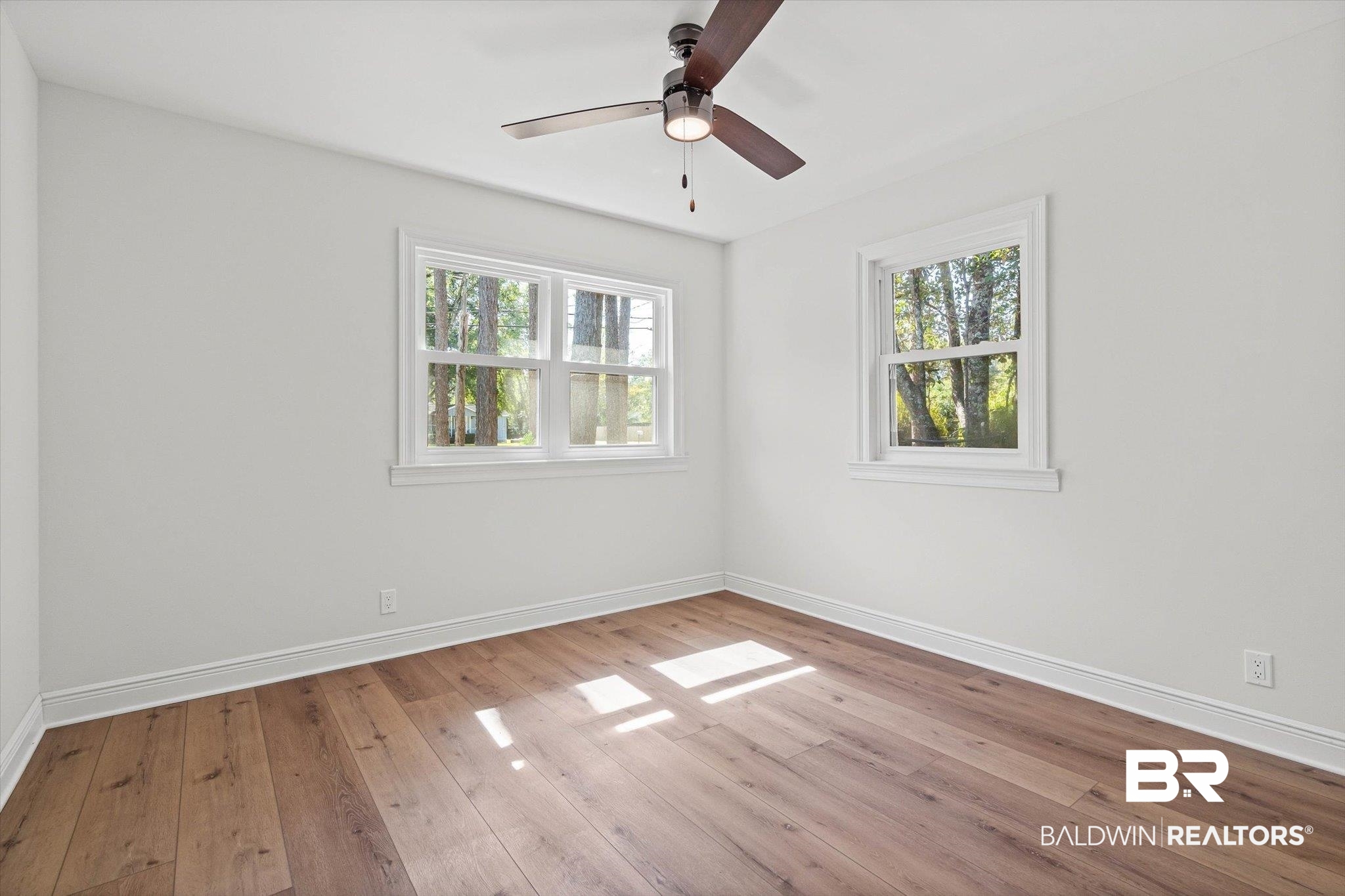 4156 Furman Drive Mobile, AL 36619 - Photo 16 of 24 Empty room featuring light wood-style flooring and a ceiling fan