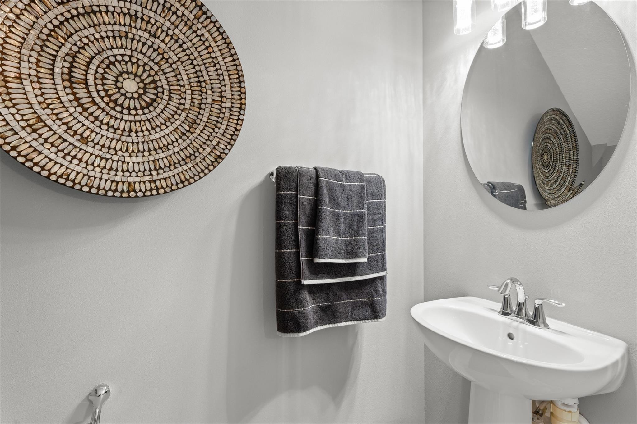 651 Southwest Glen Crest Way, Unit 2 Stuart, FL 34997 - Photo 10 of 41 a bathroom with a sink and a mirror