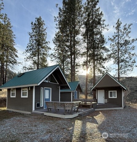 76 Chelan Hills Acres Road Orondo, WA 98843 - Photo 2 of 12 a front view of a house with yard