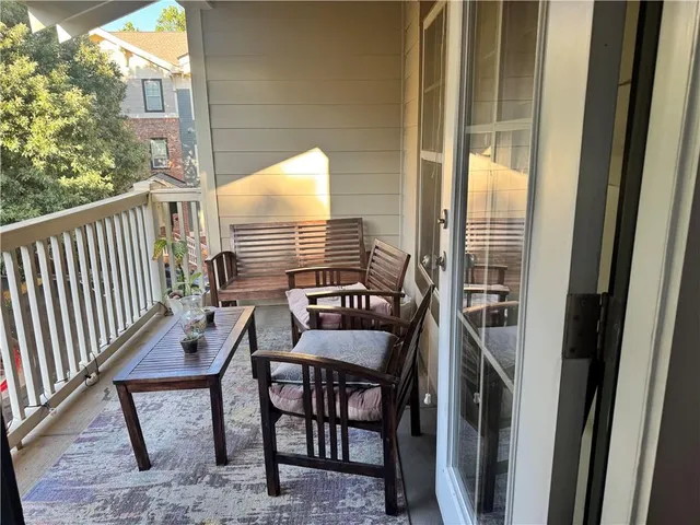 a kitchen with stainless steel appliances granite countertop a refrigerator a sink dishwasher a stove and a refrigerator