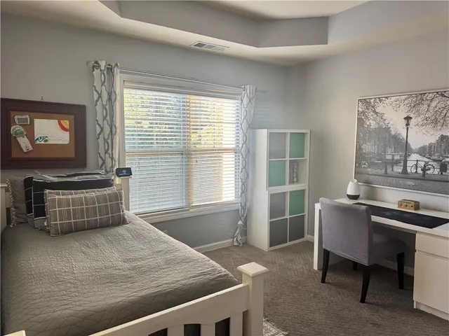 a view of a livingroom with furniture and furniture