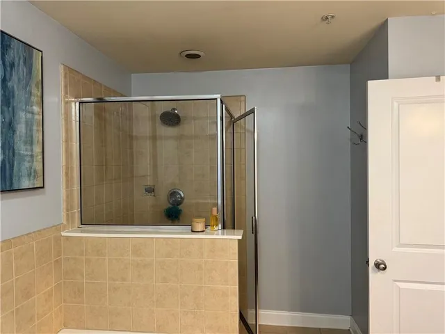 a bedroom with a bed and lamp