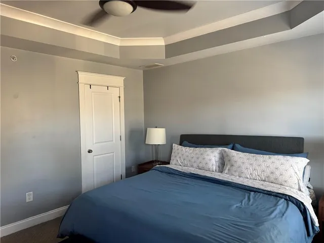 a room with pool table and windows