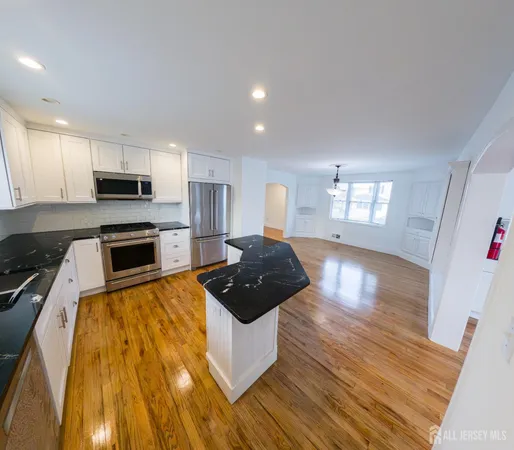 a view of a kitchen and living room