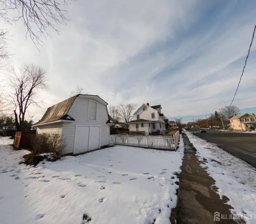 a view of a house with a snow in the yard