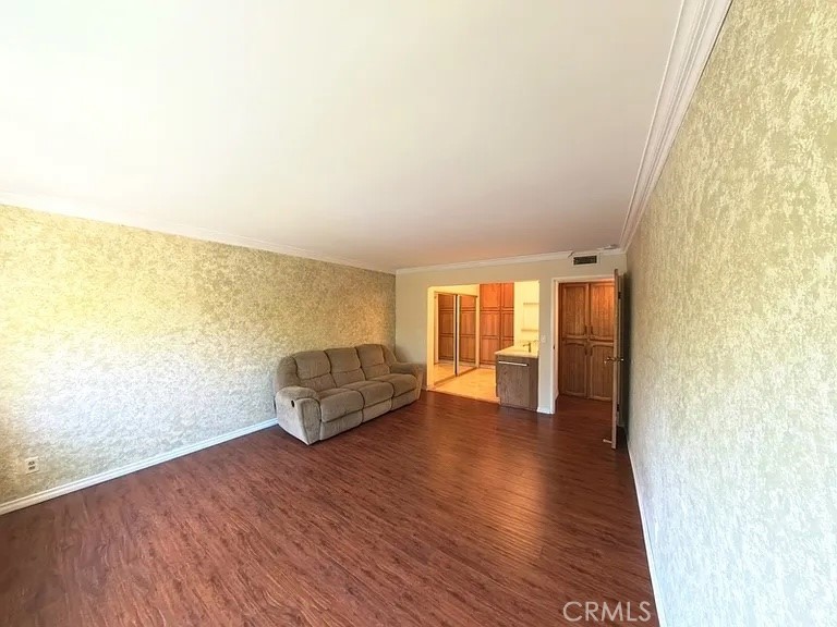 12300 Montecito Road, Unit 42 Seal Beach, CA 90740 - Photo 12 of 22 a living room with furniture and wooden floor