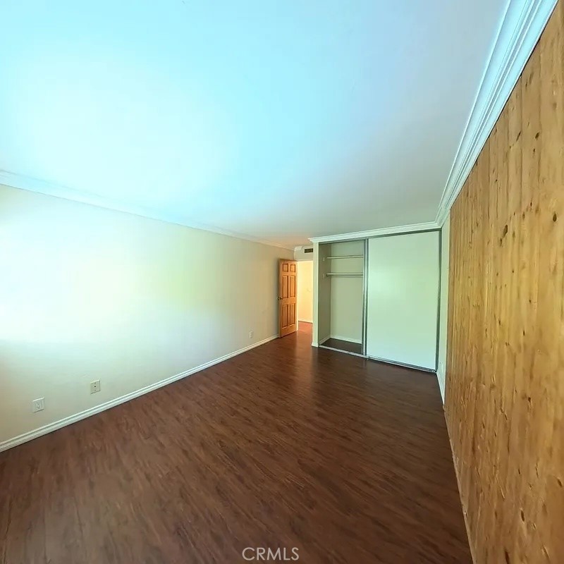 12300 Montecito Road, Unit 42 Seal Beach, CA 90740 - Photo 7 of 22 an empty room with wooden floor and windows