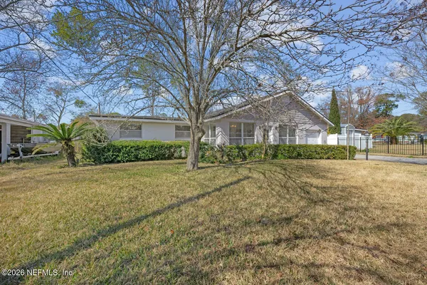 a view of house with yard