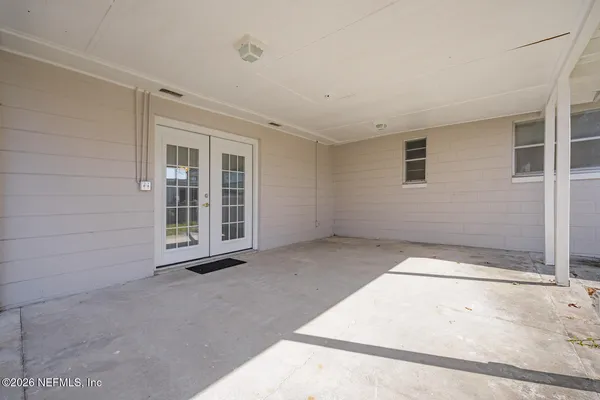 a view of an empty room with a window