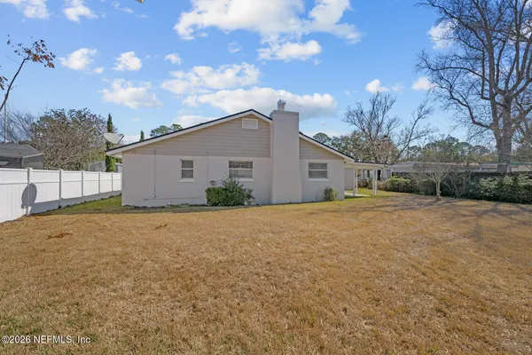 a house view with a backyard space