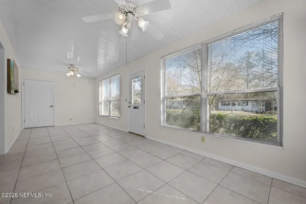 a view of an empty room with a window