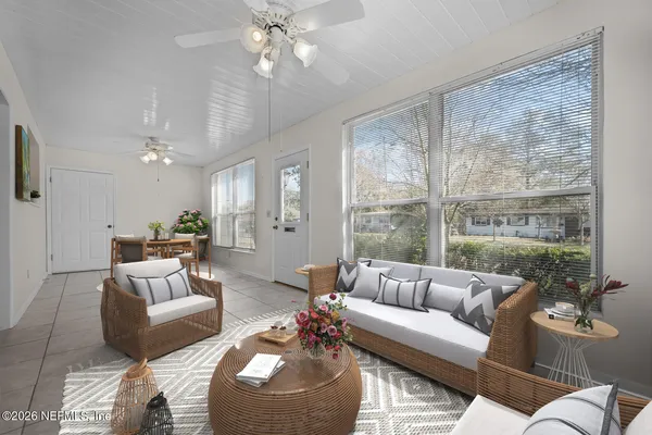 a living room with furniture and a large window