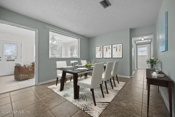 a view of a dining room with furniture
