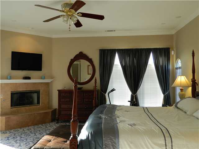 11742 Betsworth Road Valley Center, CA 92082 - Photo 14 of 21 The master bedroom has a beautiful fireplace and a door out to the patio complete with fountain. Just perfect for relaxing at the end of a long day.