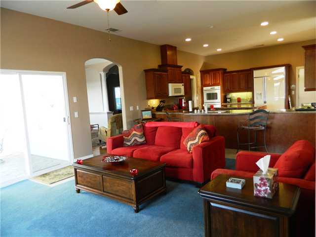 11742 Betsworth Road Valley Center, CA 92082 - Photo 16 of 21 Guests will congregate in the family room and kitchen at your next party. Or, they can step outside to the main patio with fountain. Add an infinity edge pool and no one will ever want to leave.
