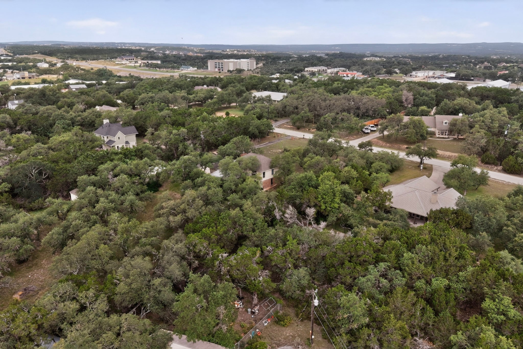 1003 Pier Branch Road Dripping Springs, TX 78620 - Photo 40 of 40 Secluded residential property nestled amidst abundant natural foliage and a tranquil rural backdrop.