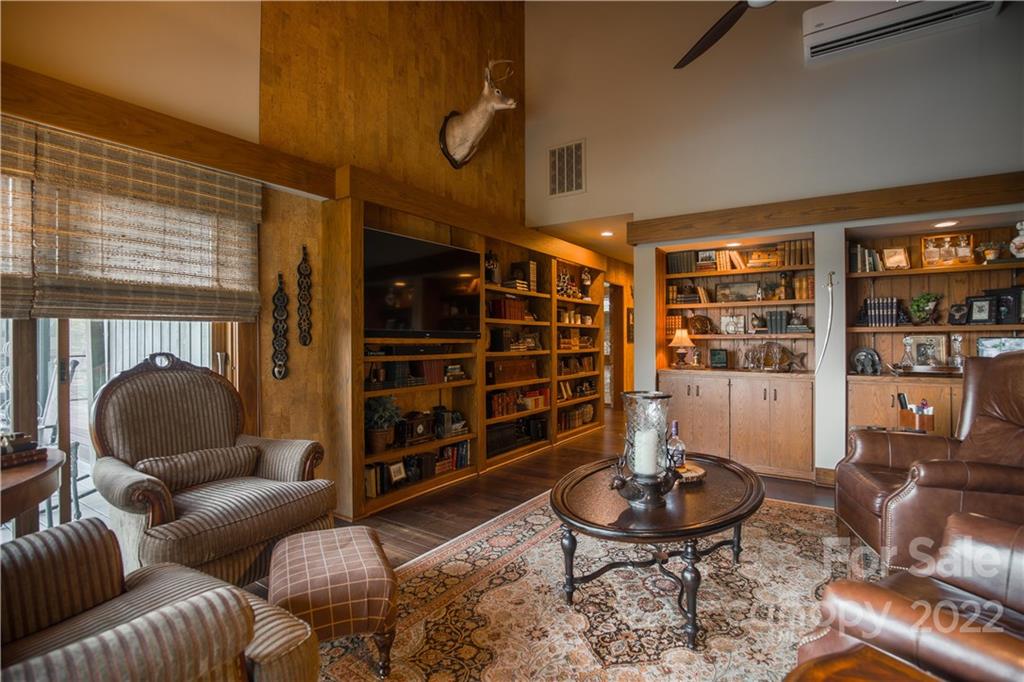 560 Club Road Tryon, NC 28782 - Photo 23 of 48 a living room with furniture a rug and a large window