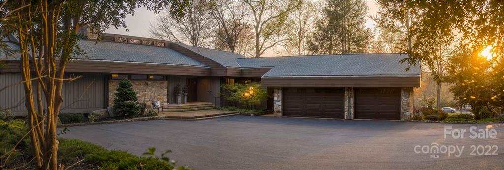 560 Club Road Tryon, NC 28782 - Photo 3 of 48 a view of a house with a yard and large tree