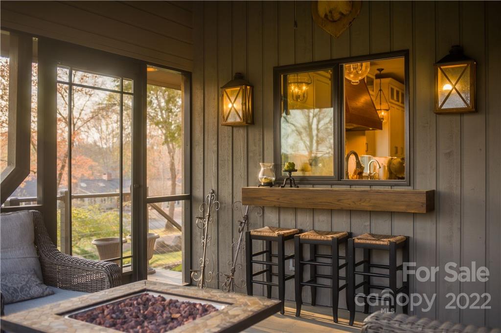 560 Club Road Tryon, NC 28782 - Photo 7 of 48 a living room with furniture and large windows